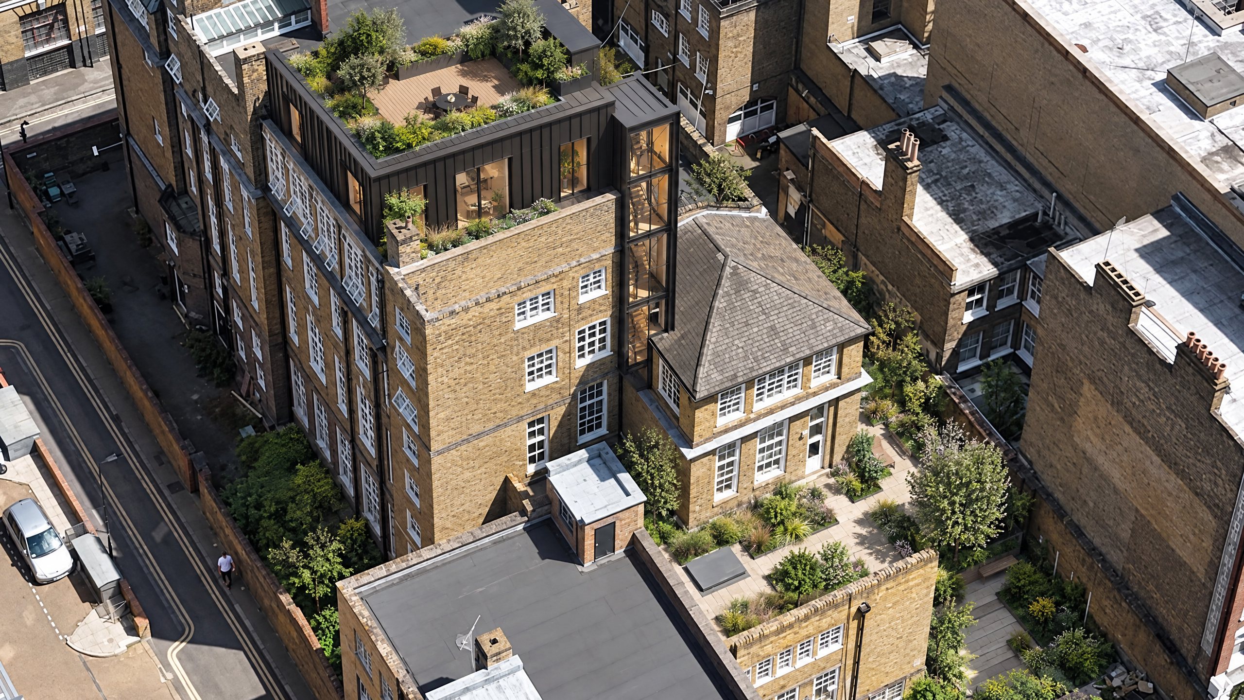 CGI of the building from above with its new top storey and roof garden, glazed lift core and landscaped gardens
