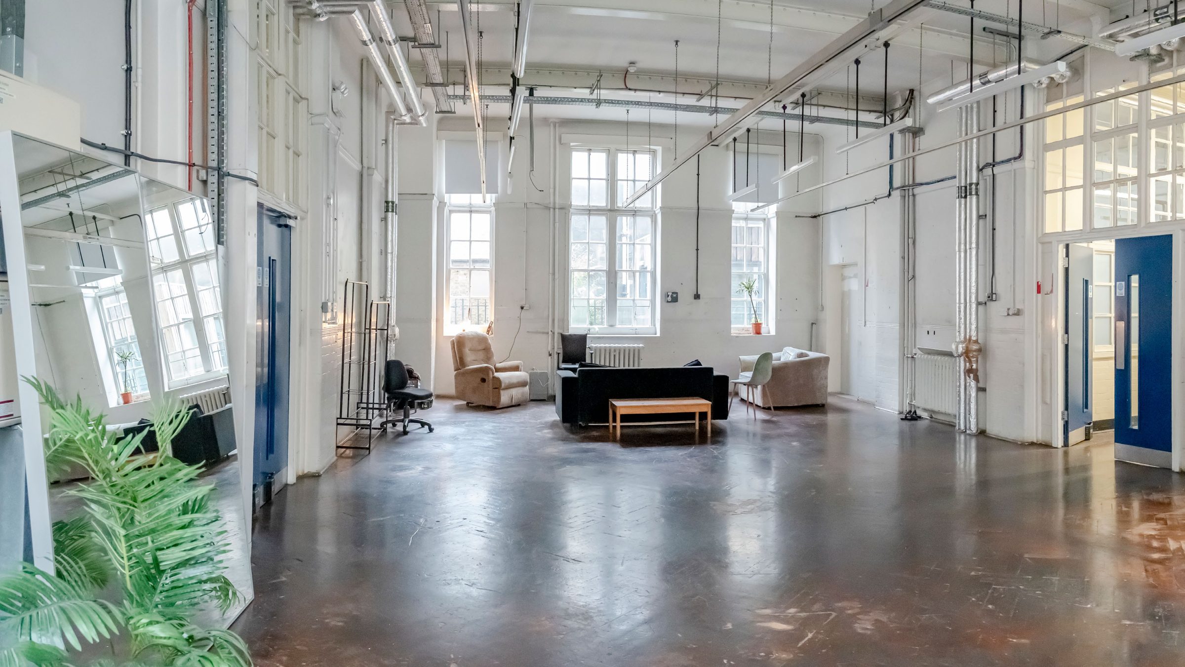 Open studio floor with tall windows